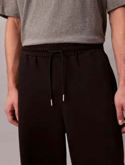 Calvin Klein Jeans miesten joggerit, LS PREMIUM TERRY CK EMBLEM JOGGER Musta