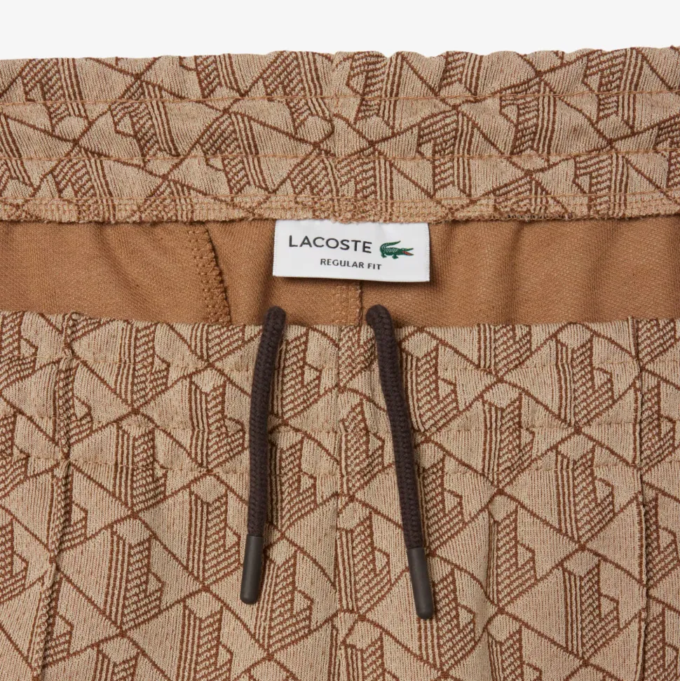 Lacoste miesten verryttelyhousut Parit Monogram Track Pant, beige