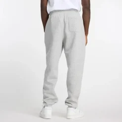 New Balance miesten collegehousut Sport Essentials Fleece Jogger Pants, vaaleanharmaa